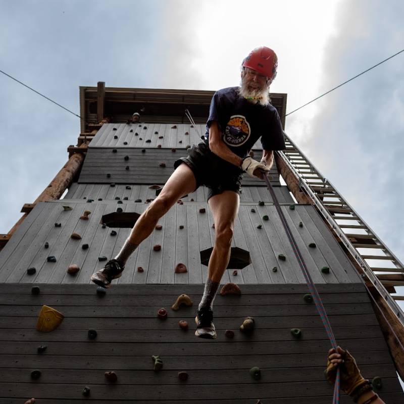 Scout climbing the Camp Hi-Sierra climbing tower