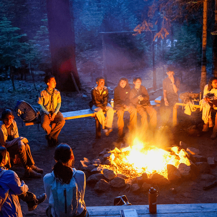 Scouts around an evening campfire at Camp Hi-Sierra